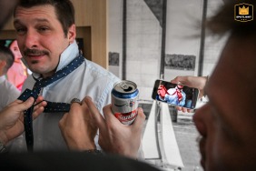 At Dazzler Hotel Rosario in Santa Fe, Argentina, the groom's friends watch a YouTube video about how to put on a tie.